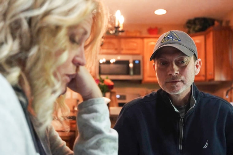 Rebecca Tennant (left) and Eric Tennant sit at the kitchen table.