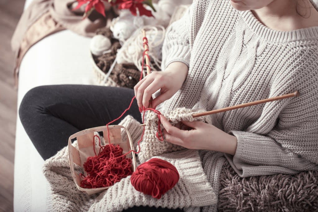 The study found that doing mentally stimulating activities like knitting while sitting may help prevent dementia. Puhimek – Stock.adobe.com