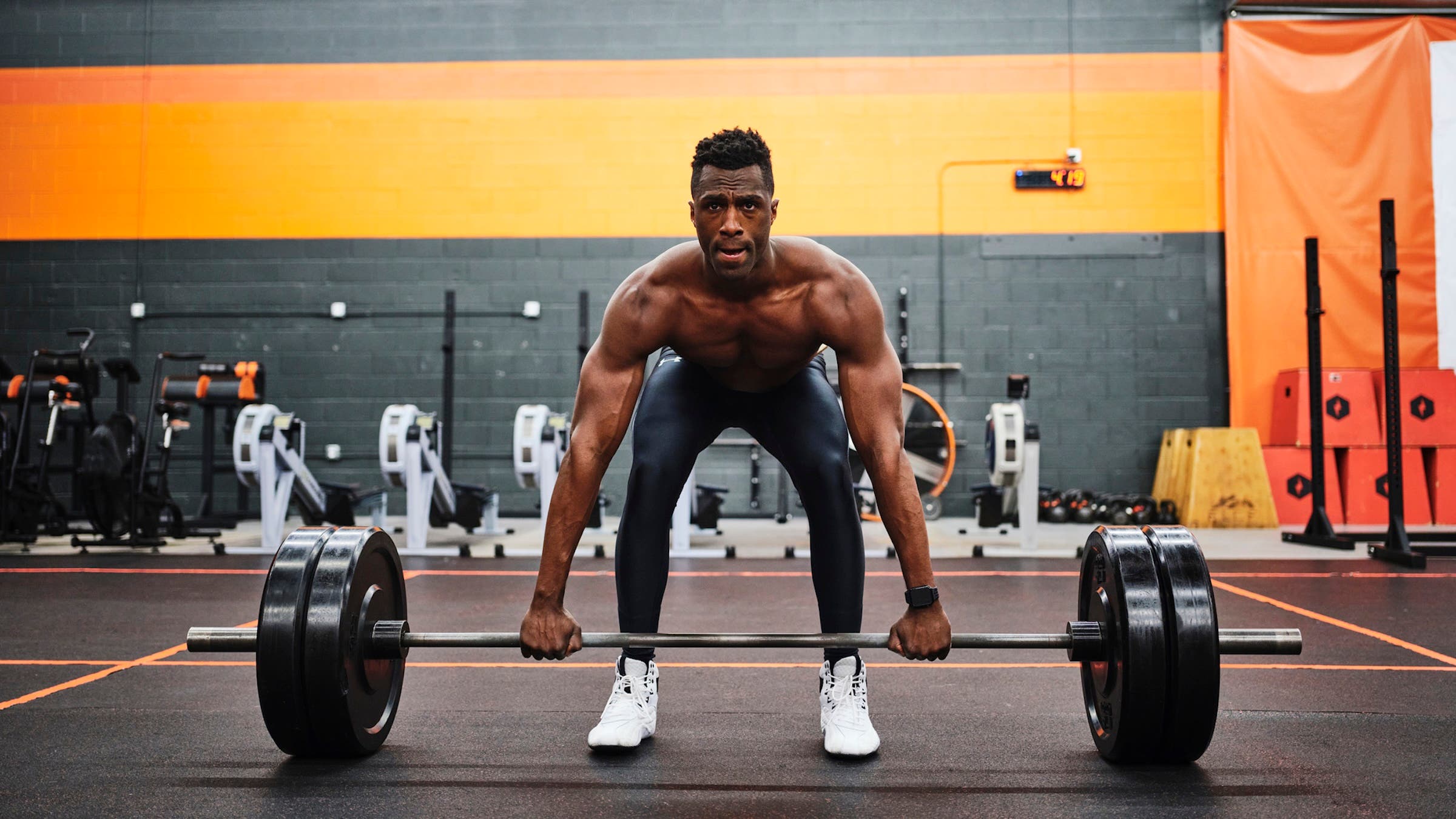 Man preparing for lifting at the gym
